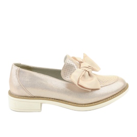Svarta slip-on skor med en RS-WED2 rosett gyllene