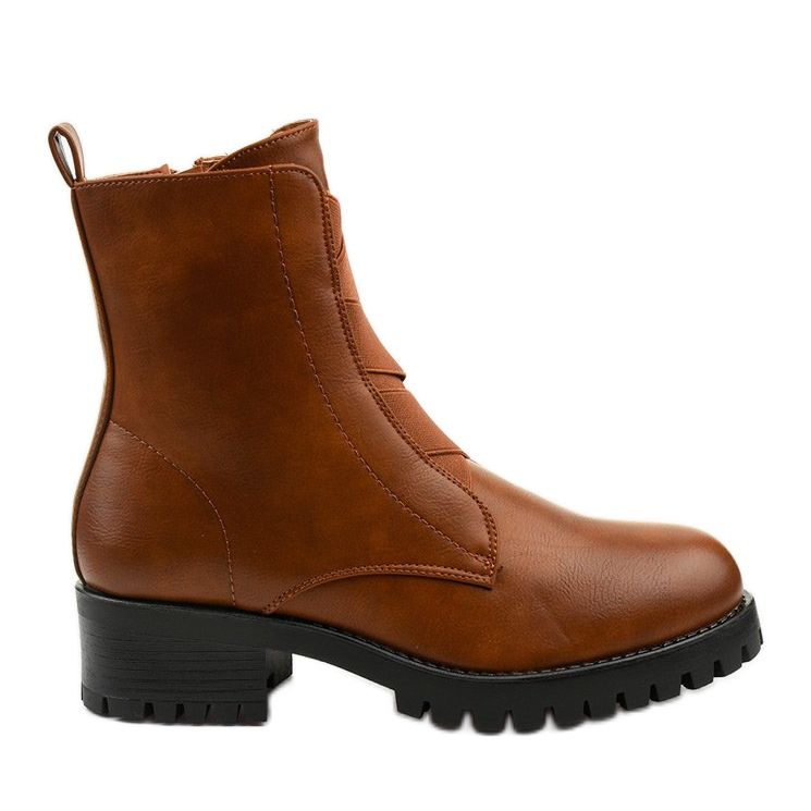 Bruna stövlar på stolpen av isolerade Chanhett