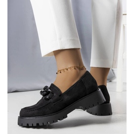 Svarta herrar prydda med en Arpin-kedja 1