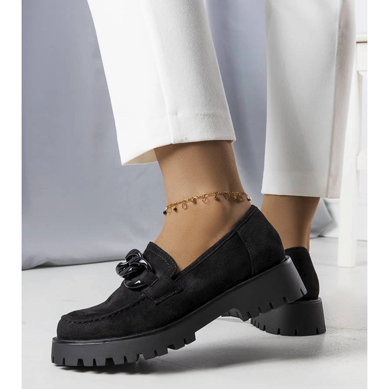 Svarta herrar prydda med en Arpin-kedja 1