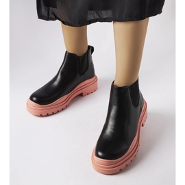 Svarta ankelboots på en färgglad Marinene-plattform 1