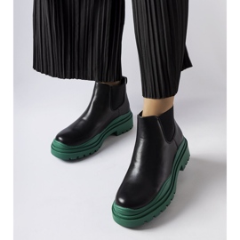 Svarta ankelboots på en färgglad Marinene-plattform 1