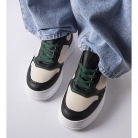 Svarta och gröna sneakers på Baron-plattformen 1