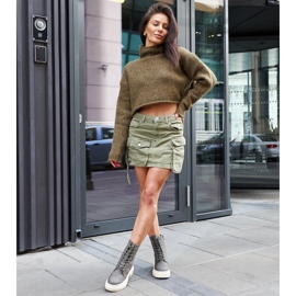 Gröna stövlar dekorerade med Niclasömmar 1