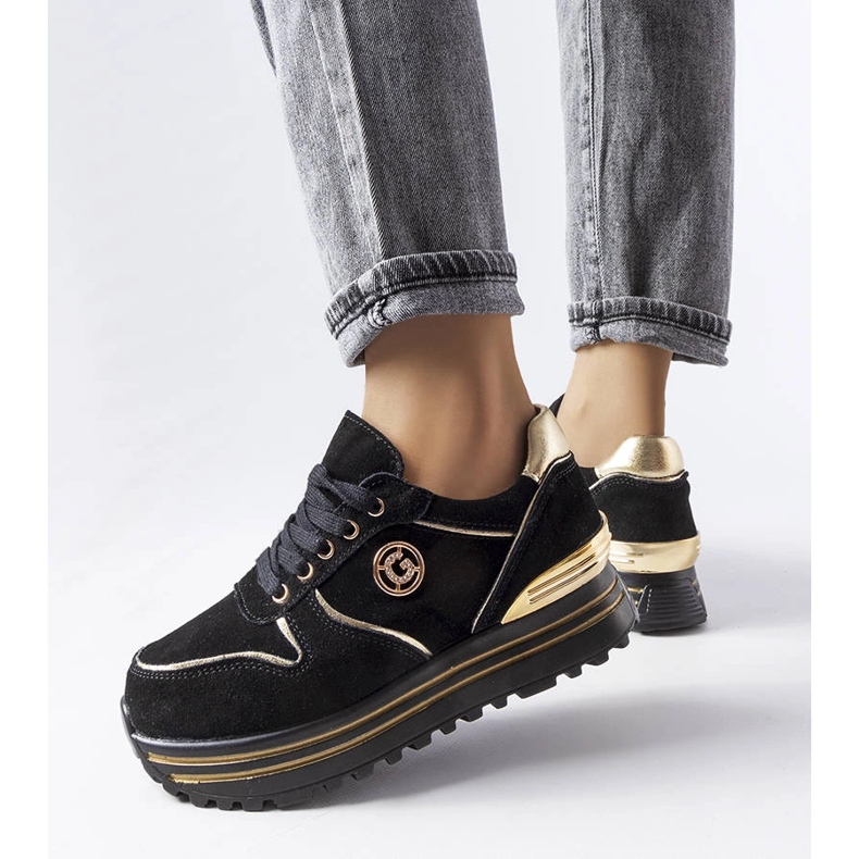 Svarta och guldiga platåsneakers från Therrien 1