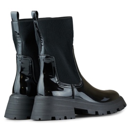 Svarta patentarbetarskor med en flexibel ovandel 1