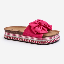 Kvinnors flip-flops på en plattform med rosett Fuchsia Evatria rosa 1