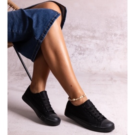 Svarta glänsande Rashidah sneakers 1