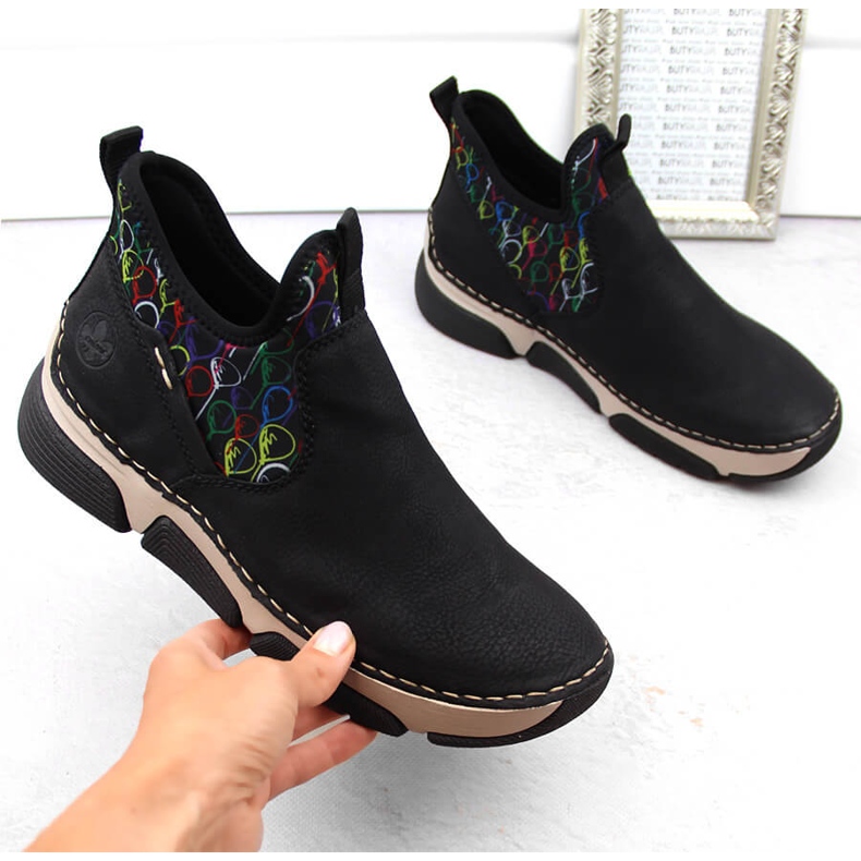 Bekväma damsvarta slip-on ankelboots Rieker 45957-00 2