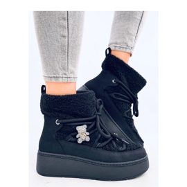 Svarta snöstövlar av fårskinn 1