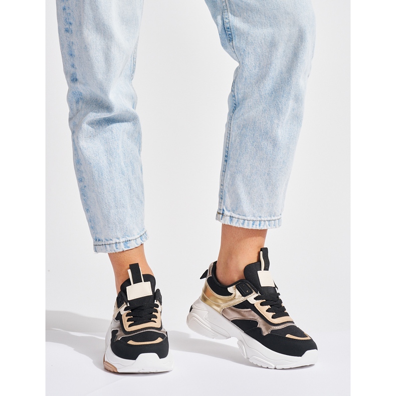 Svarta och guldiga sneakers med tjock sula 1