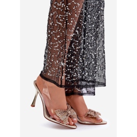 Transparenta högklackade sandaler med en glänsande guldrosett gyllene 1