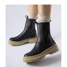 Svarta stövlar med oliv sula 1