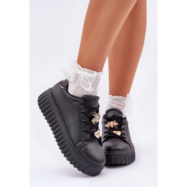 Kvinnors sneakers med svarta stift 2