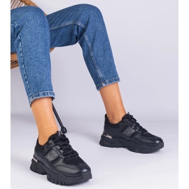 Svarta kvinnors sneakers dekorerade med glitter 1