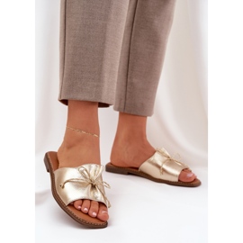 Flat sula flip flops med en dekorativ guldbåge gyllene 2