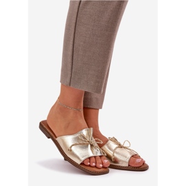 Flat sula flip flops med en dekorativ guldbåge gyllene 1