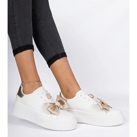 Kvinnors vita och guld sneakers med en båge 2
