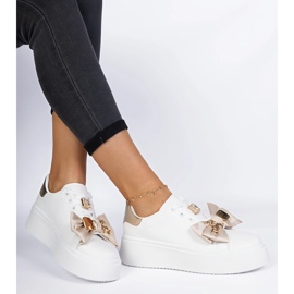 Kvinnors vita och guld sneakers med en båge 1