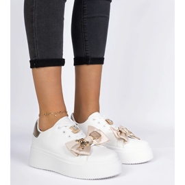 Kvinnors vita och guld sneakers med en båge 4