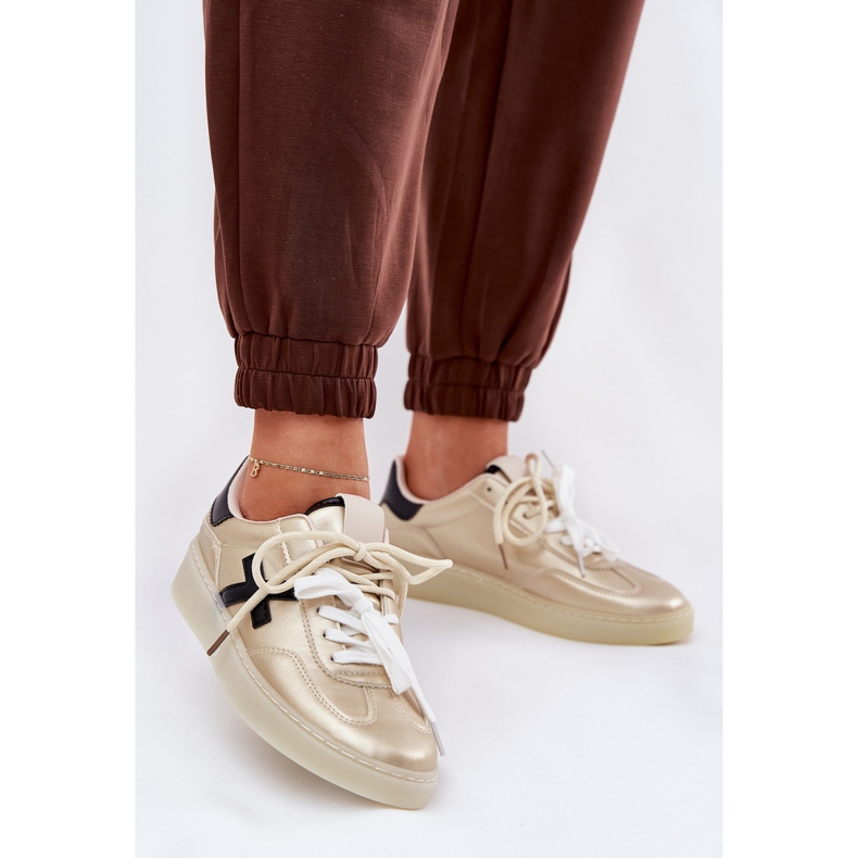 Låga kvinnors sportskor gyllene 2