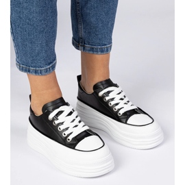Svartvita kvinnors sneakers på en hög sula 3