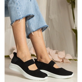 Svarta kvinnors sneakers på en pressad sula 1