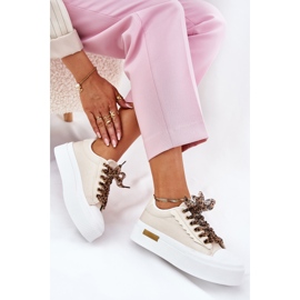 Kvinnors sneakers på en massiv plattform med dekorativ snörning beige 1