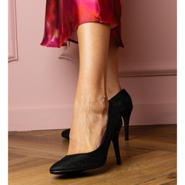 Svarta pumpar på en brokadfinish 2