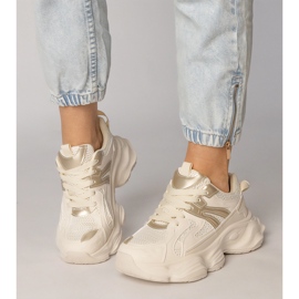 Beige sneakers kvinnors sport med en gyllene införande 2