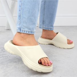 Kvinnors flip flops på en tjock plattformspool Beige News 7303 6