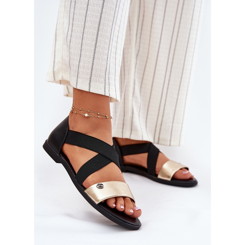 EVento Platta kvinnosandaler med flexibla svarta och guldband 2
