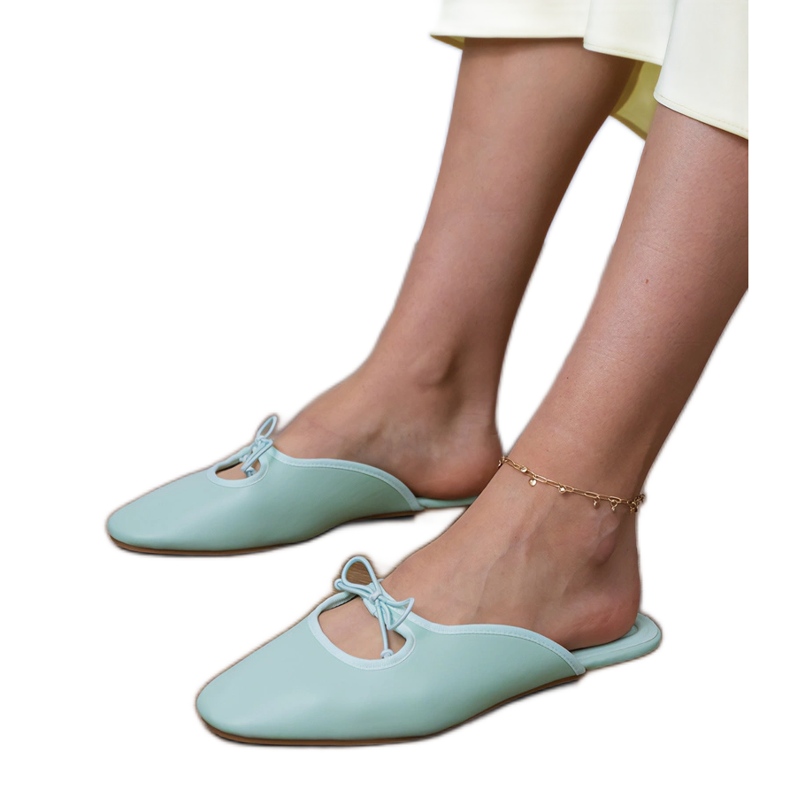 Grön flip -flops byggd på en platt sula 1