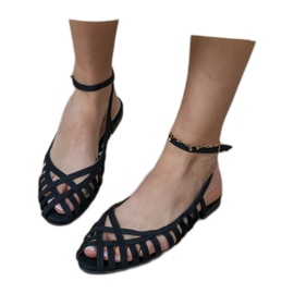 Svarta kvinnors platta sandaler byggda -up 4