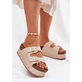 Kvinnors flip flops med spännen på en massiv plattform beige 2