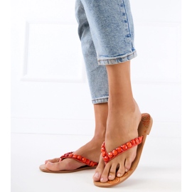 Orange flip -flops flip -flops dekorerade med stenar 2