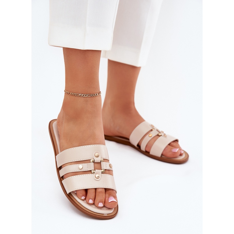 Platta kvinnors flip flops med gyllene detalj beige 2