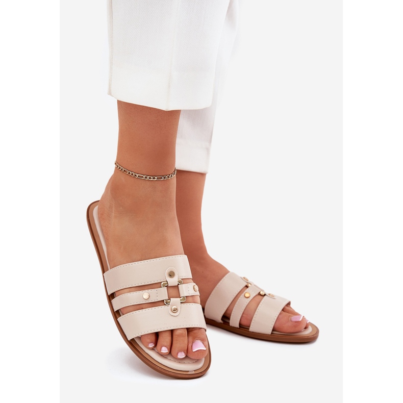 Platta kvinnors flip flops med gyllene detalj beige 1