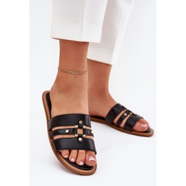 Platta kvinnors flip flops med gyllene detalj svart 2