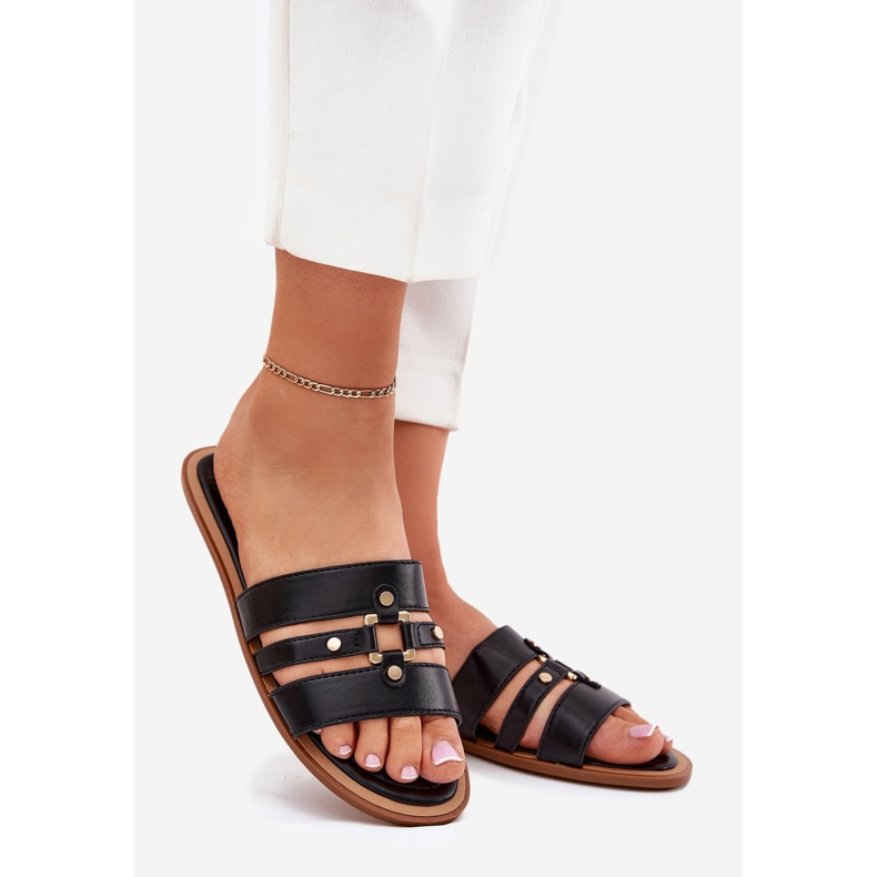 Platta kvinnors flip flops med gyllene detalj svart 1