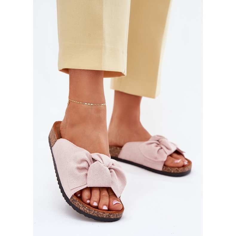 Kvinnors flip flops på korksulan med en ljusrosa båge 2
