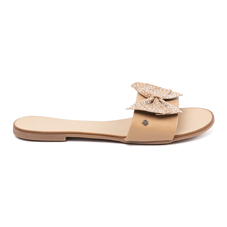 Shelvt Beige flip flops med en båge i strassen 1