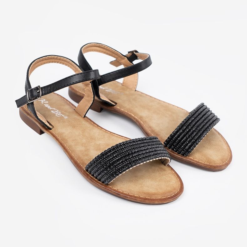 Shelvt Svarta sandaler på en platt sula 1