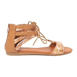 Shelvt Sanadals spetsar med ett ormmotiv 2