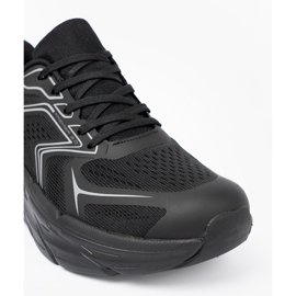 Shelvt Lätt svarta sportskor på en tjock McArthur -sula 1