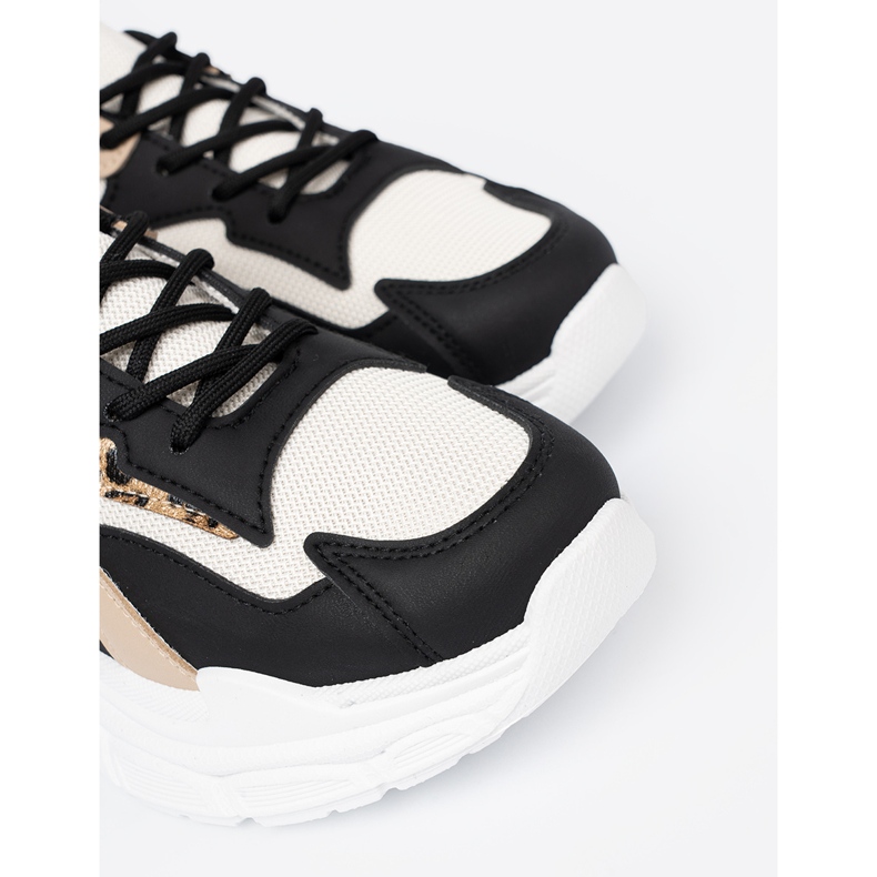 Shelvt Svart och beige kvinnors sneakers på en tjock sula 1