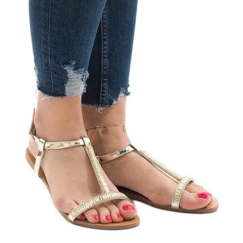 Gyllene sandaler dekorerade med SY-644 1