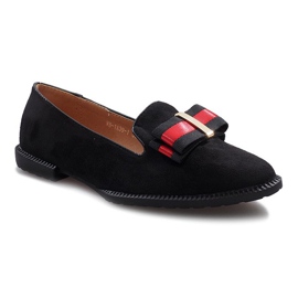 Svarta slip-on skor med en Rossa rosett 1