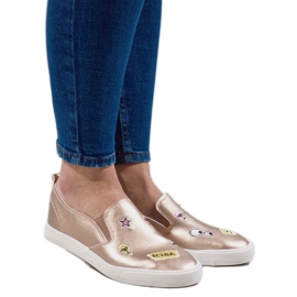 Gyllene sneakers med G82-5-tryck 1