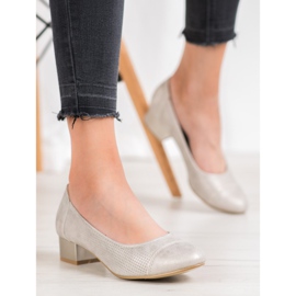 Goodin Genombrutna pumpar på en pelare gyllene 1